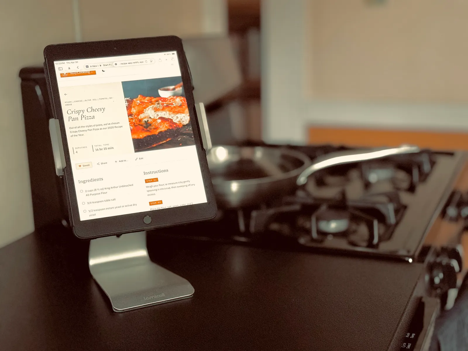 Cooking from a recipe on an iPad propped on the kitchen counter.